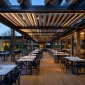 Restaurant retractable roof system for outdoor dining terrace