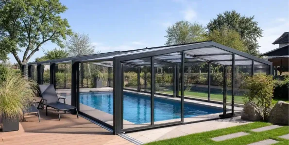 modern retractable pool enclosure covering backyard swimming pool with telescopic aluminum structure