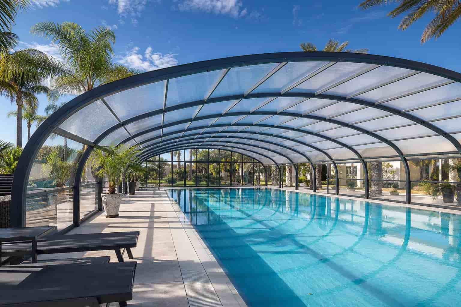 automatic retractable pool enclosure covering outdoor swimming pool