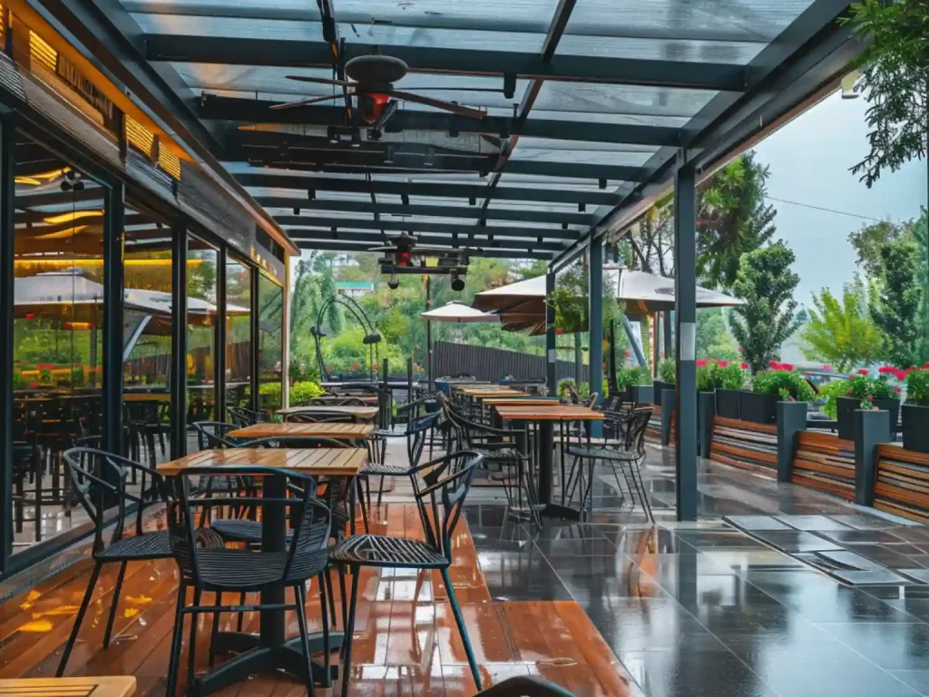 Retractable roof protecting restaurant patio during rain