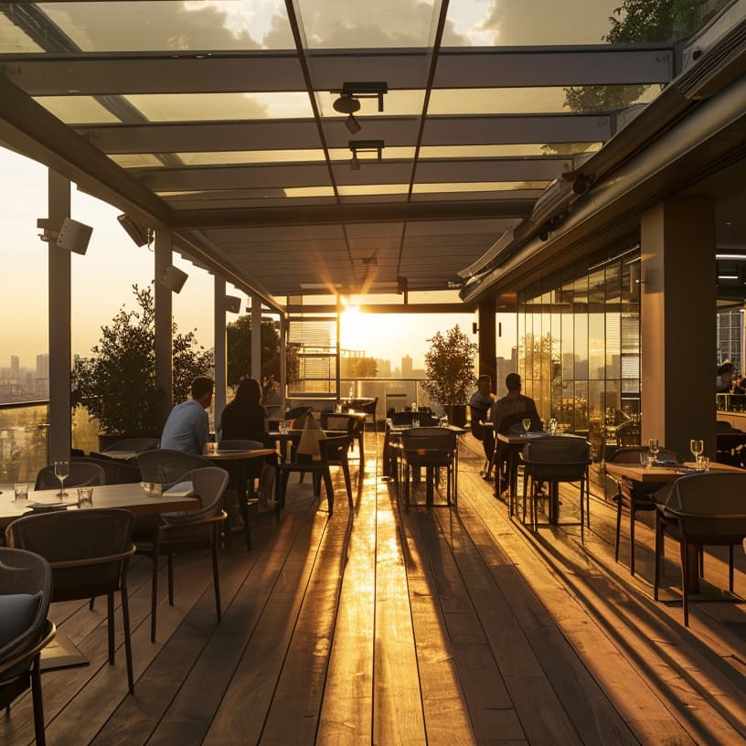 rooftop restaurant with retractable glass roof system and city skyline view