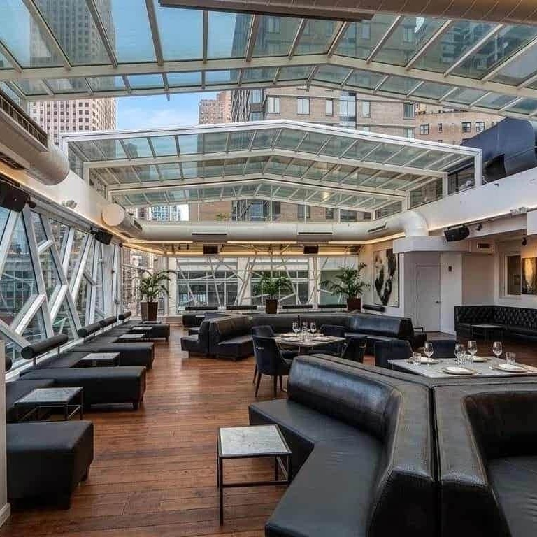 hotel courtyard lounge with retractable glass roof system