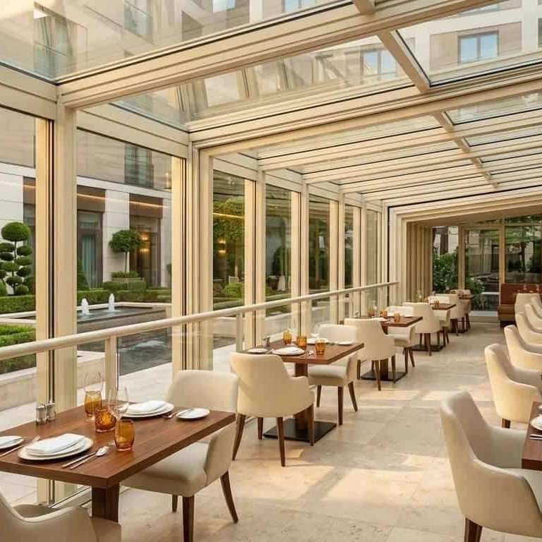 hotel restaurant terrace with retractable glass roof structure