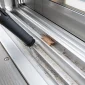 Cleaning debris and dust from the aluminum sliding track of a retractable sunroom