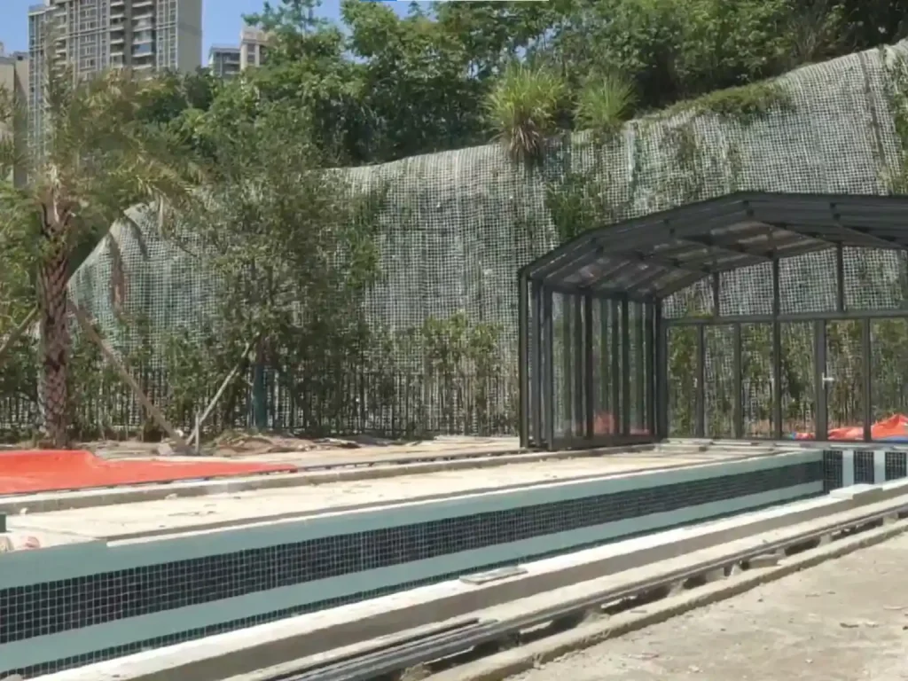 Residential pool glass enclosure providing weather protection for an outdoor pool