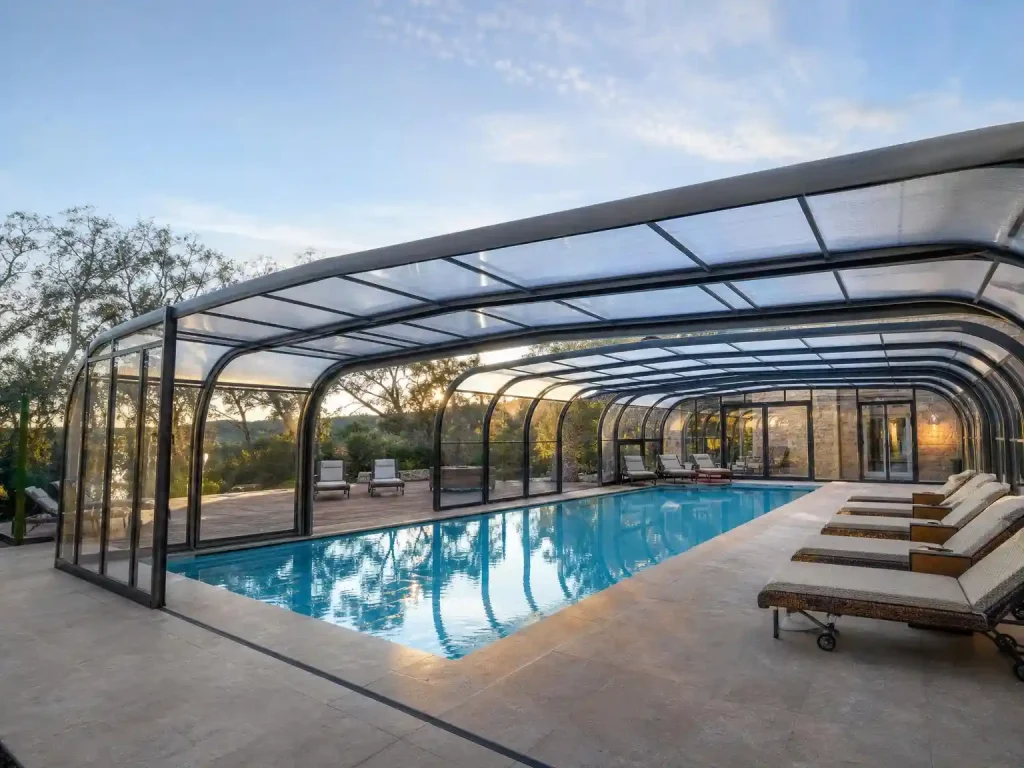 Completed retractable pool enclosure for resort swimming pool