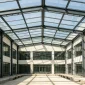 Glass roof courtyard for commercial building with transparent roof system