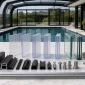 Glass and polycarbonate materials for pool enclosure and pool sunroom systems