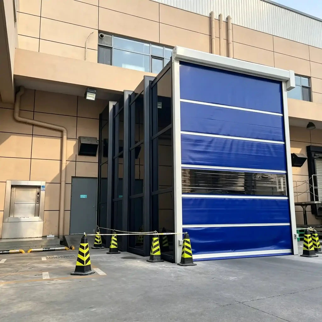 Blue industrial retractable walkway system connecting factory buildings with covered corridor protection