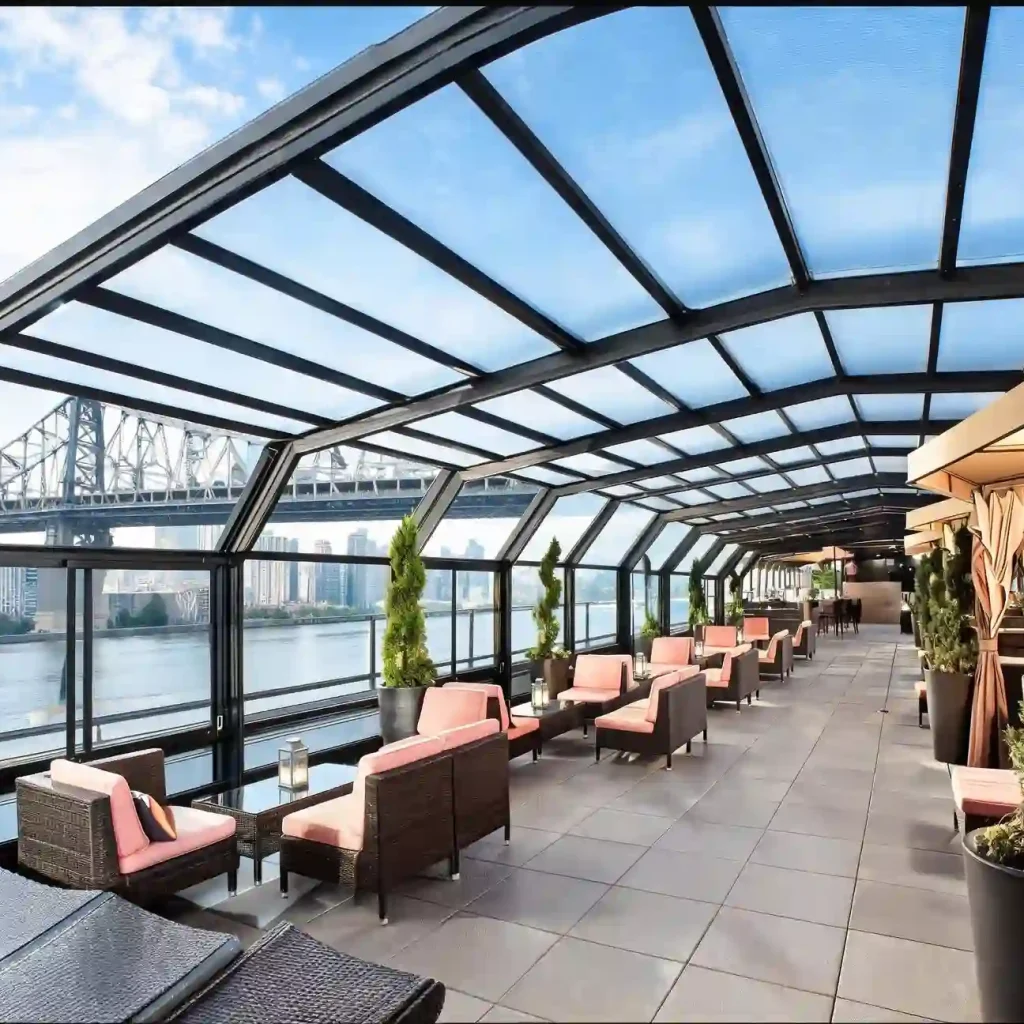 Outdoor entertainment terrace with retractable glass roof and waterfront seating area