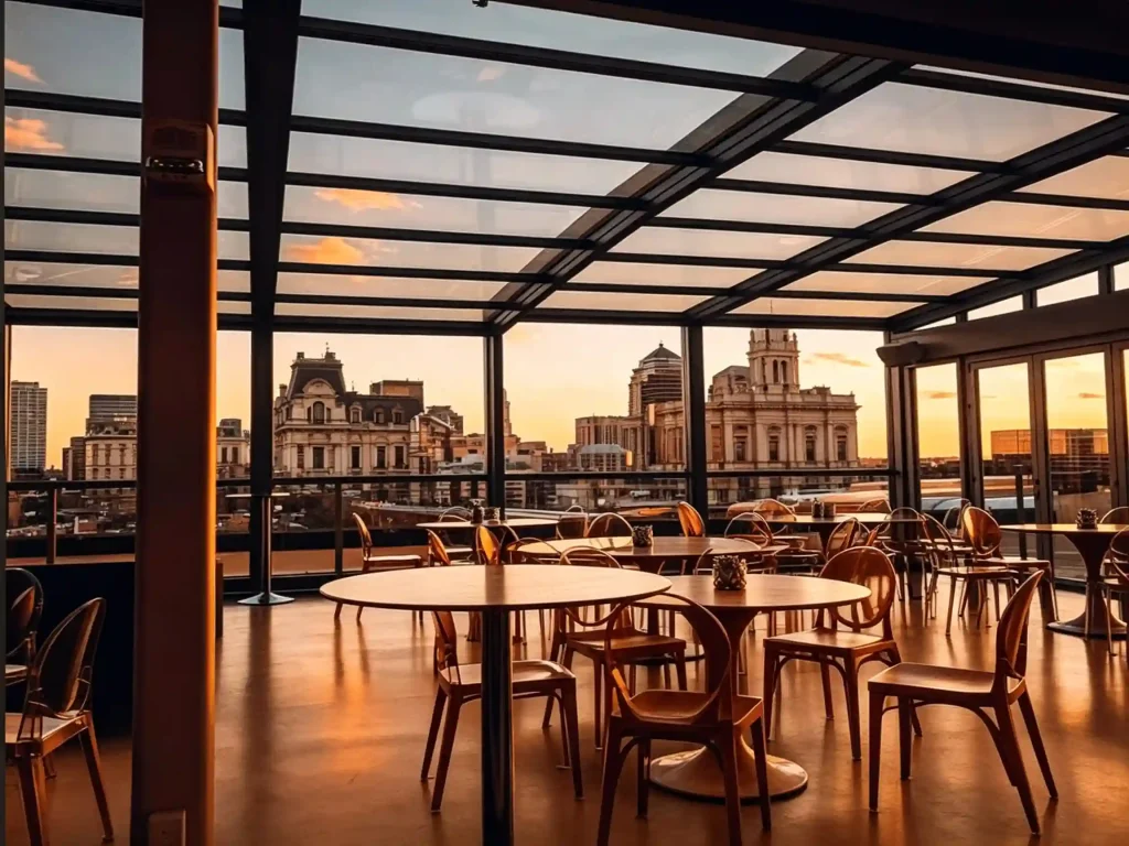 Restaurant courtyard retractable glass roof for weather-protected dining