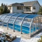 Pool enclosures for winters with snow protecting a backyard swimming pool