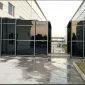 Retractable walkway between factory buildings for protected industrial access
