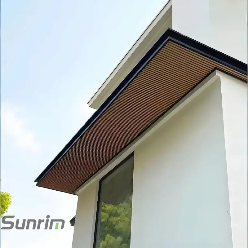 Modern aluminum front door canopy with brown wood grain underside