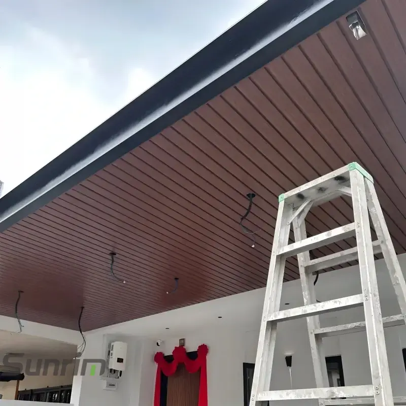 Installation view of custom aluminum entrance canopy ceiling panels