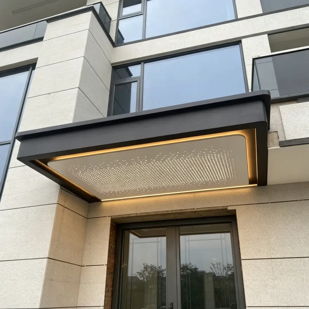 Black aluminum door awning with decorative star ceiling