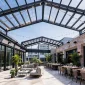 Retractable roof systems for patios restaurants and courtyards